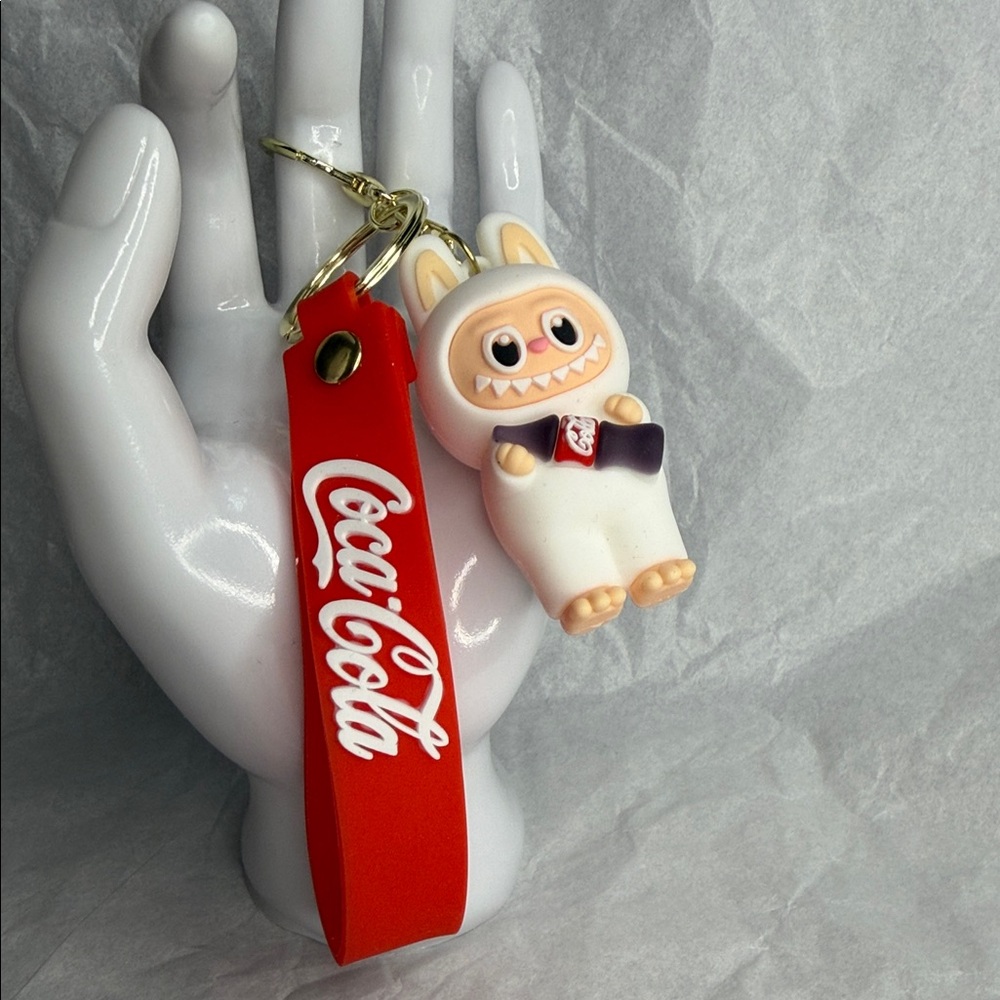 Coca-Cola Red and White Keychain with Adorable Monster Figurine